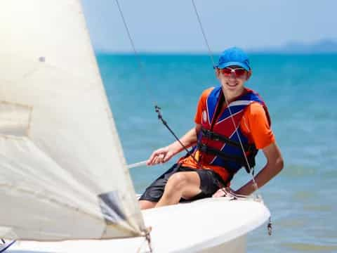 a man on a sailboat