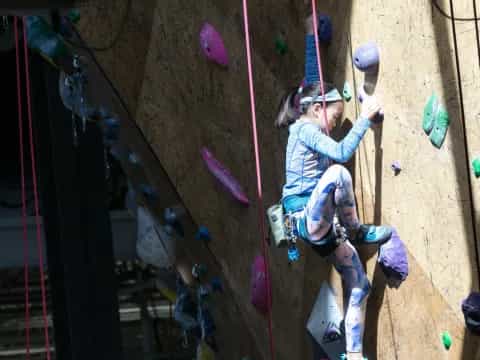 a person climbing a rock wall