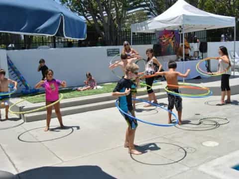 a group of kids playing with hoops