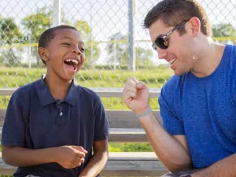 a group of men sitting on a bench