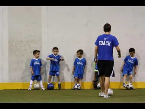a group of boys in blue uniforms