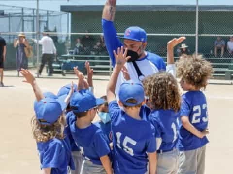 a group of kids in blue shirts