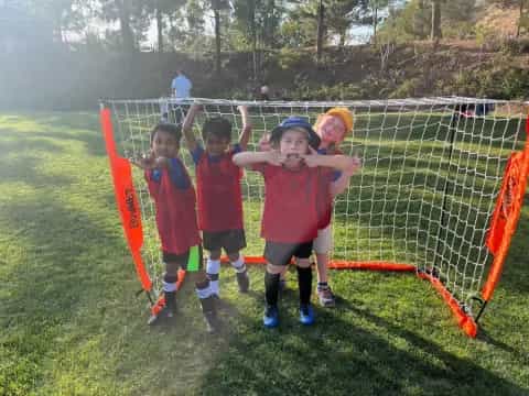 a group of kids playing football