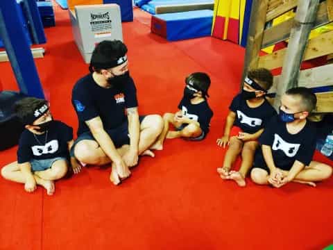 a group of kids wearing masks