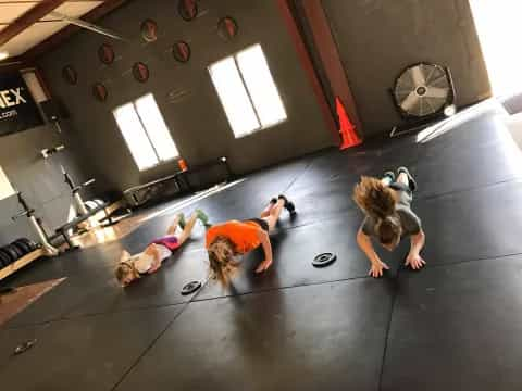 a group of women doing yoga