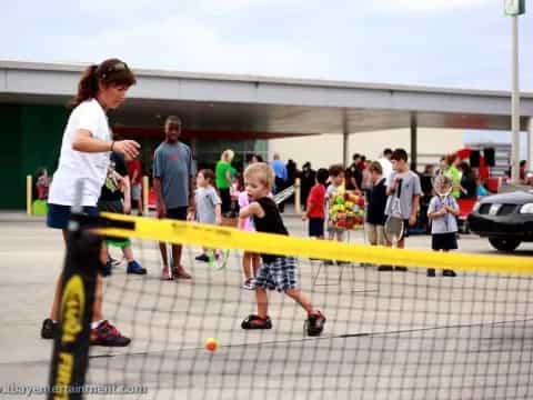 a person and a child playing a sport