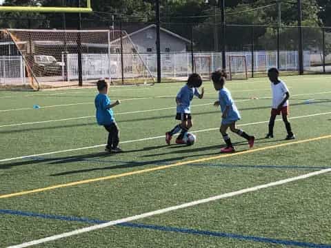 kids playing football on a field