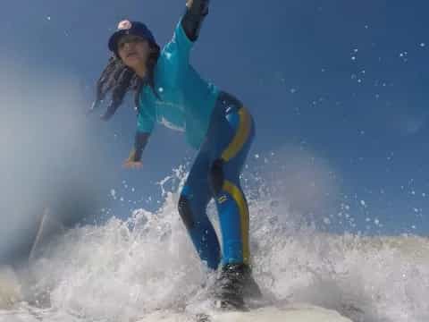 a person surfing on the waves