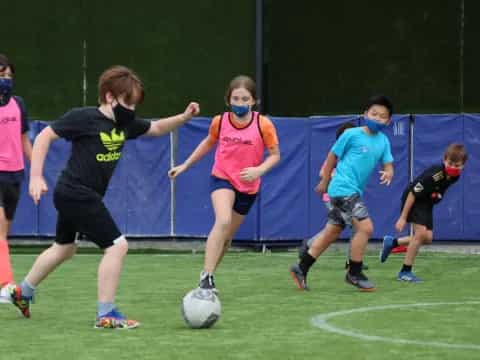 a group of people play football