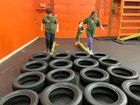 kids with skateboards in a room