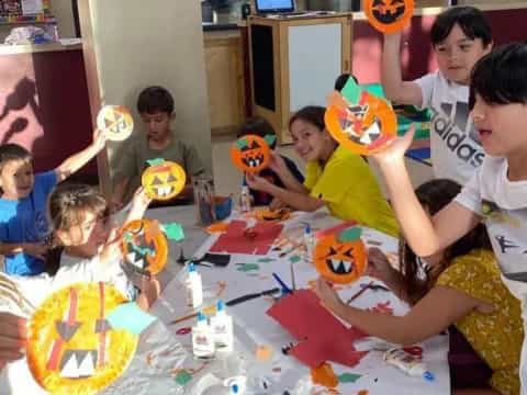 a group of kids around a table