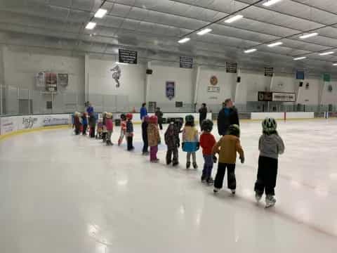 a group of people on an ice rink