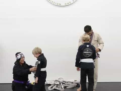 a group of people standing in a room with a sign