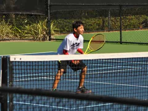 a man holding a tennis racket