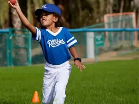 a boy throwing a ball