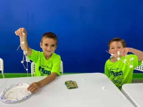 a couple of boys eating food