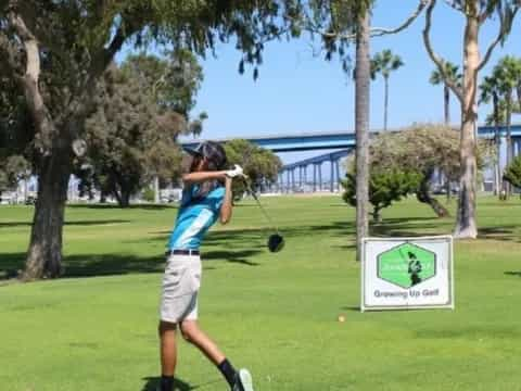 a man swinging a golf club