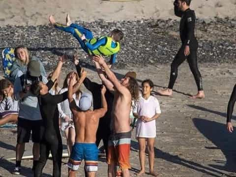 a group of people on a beach