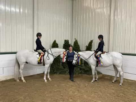 a group of women riding horses