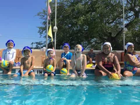 a group of people in a pool