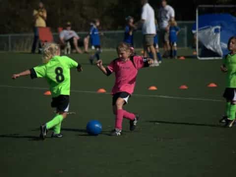 kids playing football on a field
