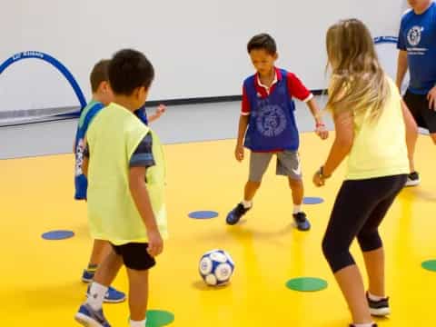 a group of kids playing football