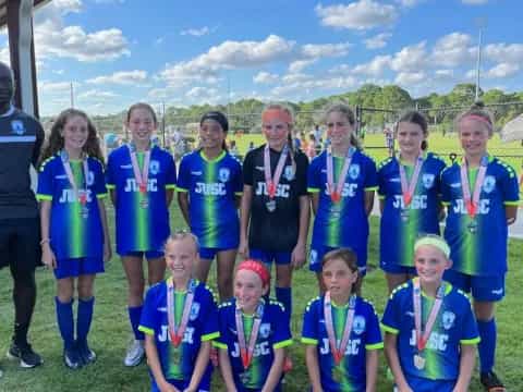 a group of people wearing medals