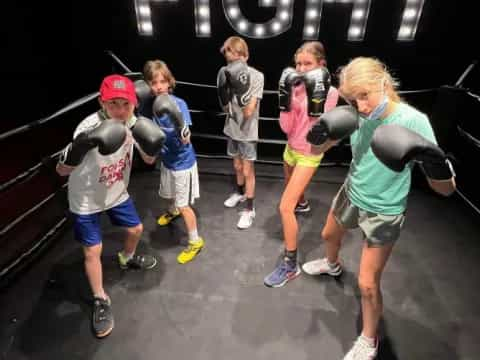 a group of people in a boxing ring