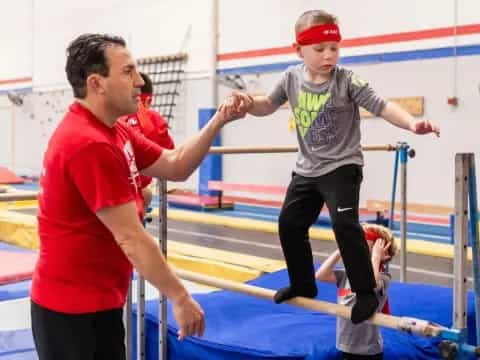 a person and a boy on a trampoline