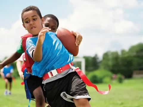 a couple of boys playing football