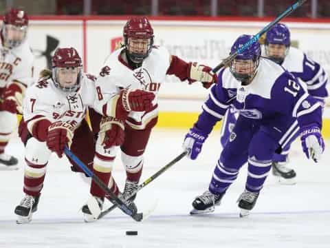 a group of hockey players on ice