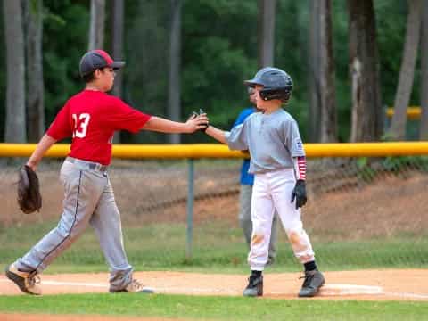 a couple of kids playing baseball