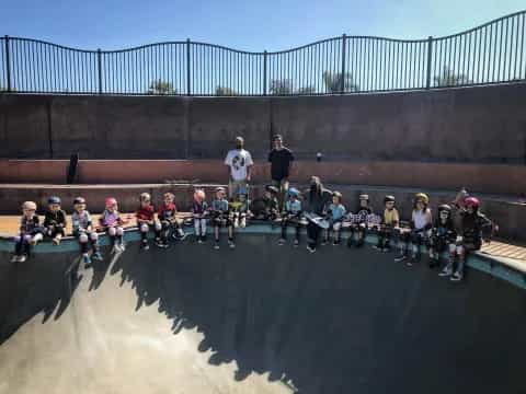 a group of people sitting on a ramp