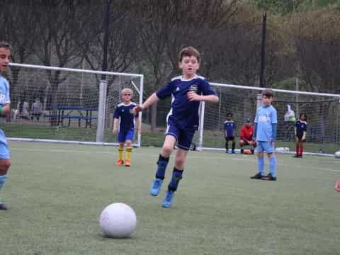 a group of kids playing football