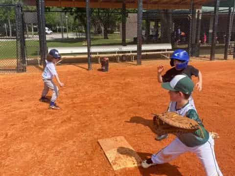 a couple of kids playing baseball