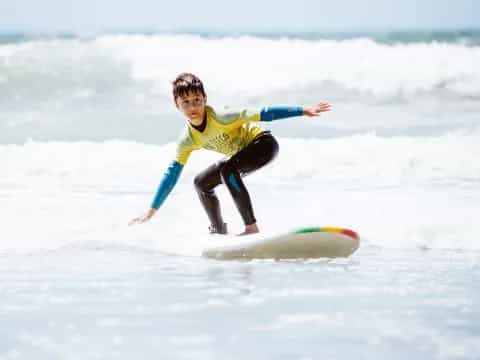 a girl surfing on the waves