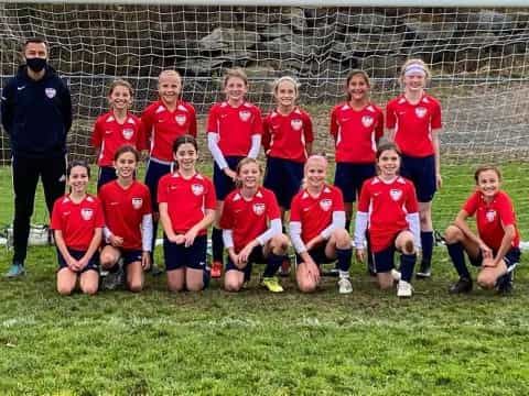 a group of people in red uniforms