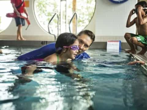 a man and woman in a pool