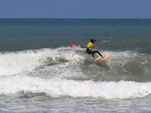 a man surfing on the waves