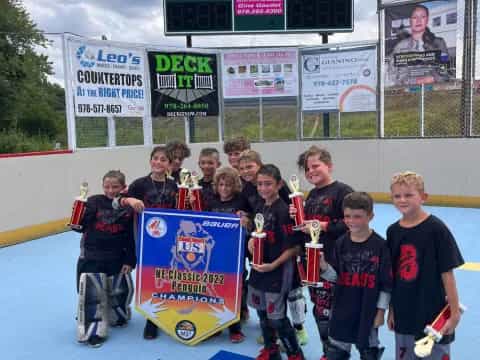 a group of boys holding a sign