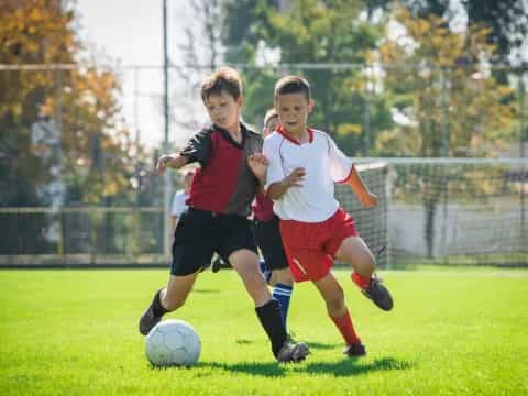 a couple of boys playing football