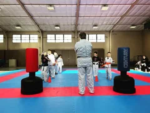 a group of people in a karate class