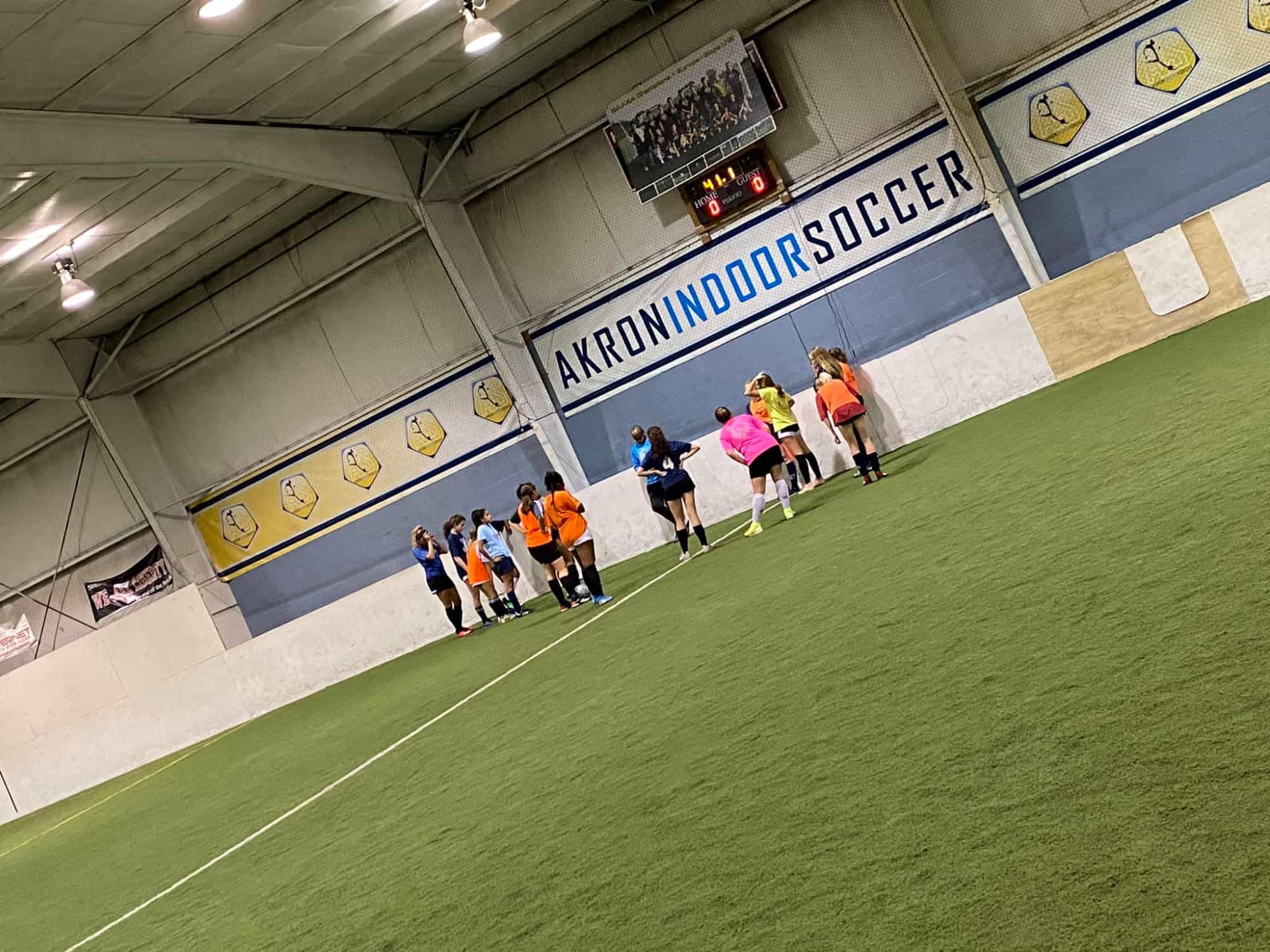 a group of people walking on a green track