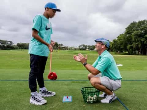 a man and a woman playing golf