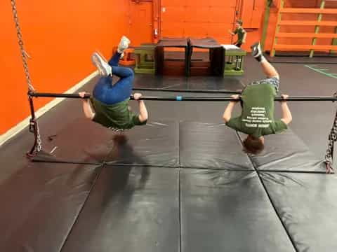 a person doing a handstand on a mat