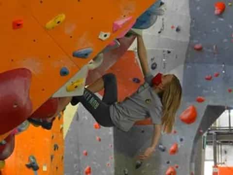 a person climbing a rock wall