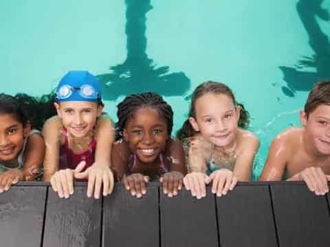a group of children in a pool