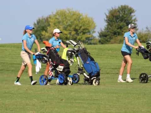 a group of people playing golf