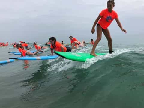 a group of people on surfboards