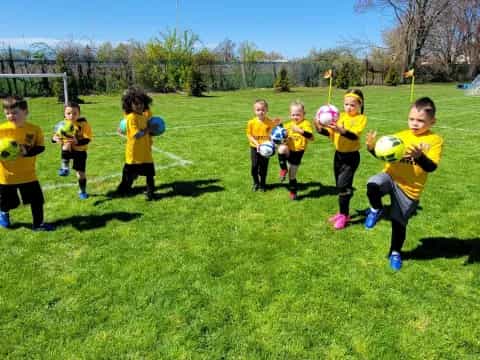 a group of kids playing football